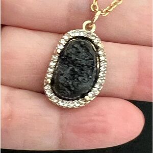 Black and gold plated pendant plus matching necklace
